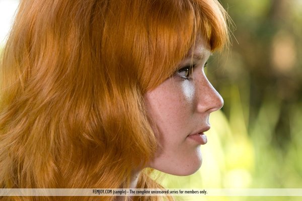 Redheaded Margy is seen in a close-up photo of her pretty face.